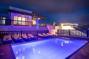 674big-1260-playa-blanca-villa-vista-rey-swimming-pool-night
